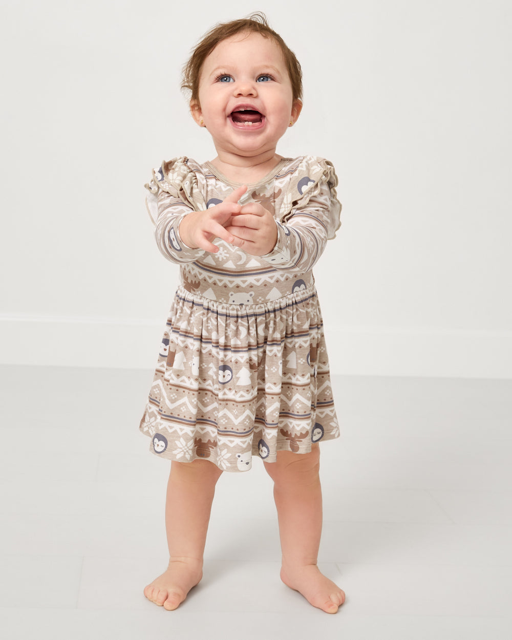 Baby wearing the Frosty Fair Isle Flutter Skater Dress with Bodysuit