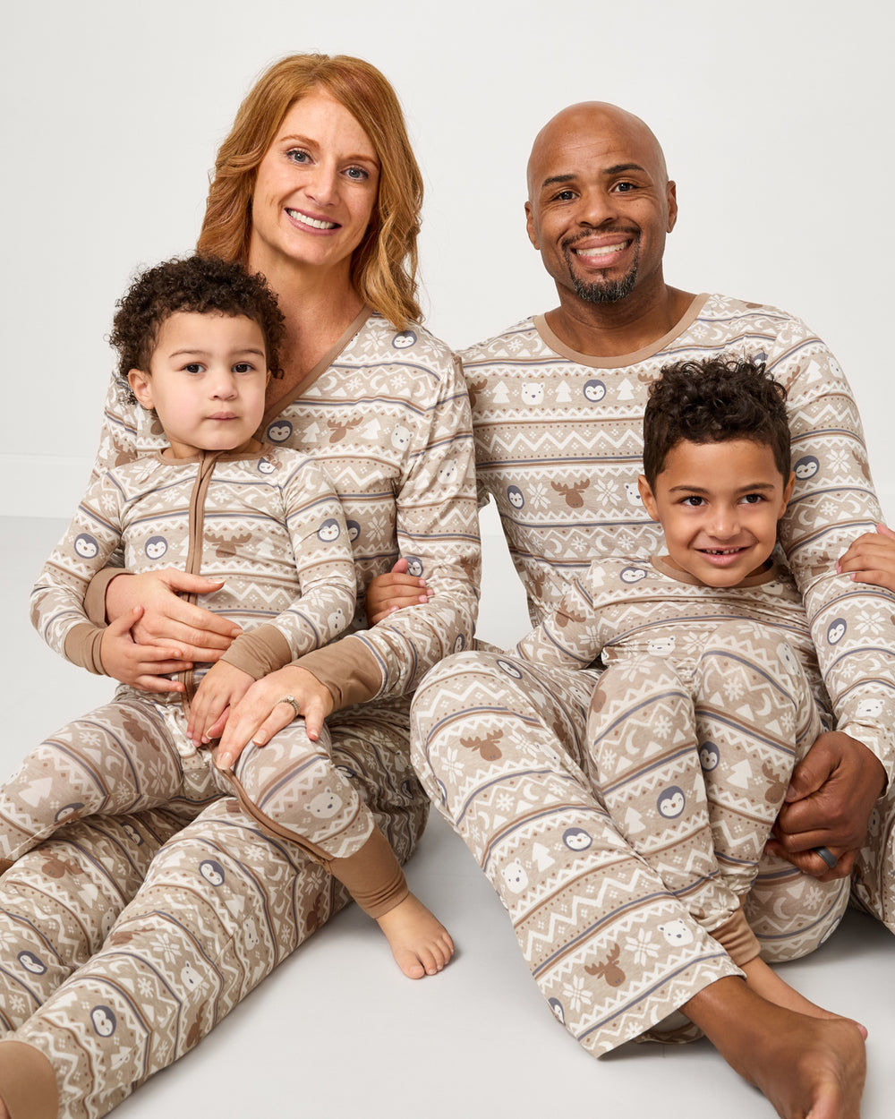Family of four wearing the Frosty Fair Isle bamboo pajamas