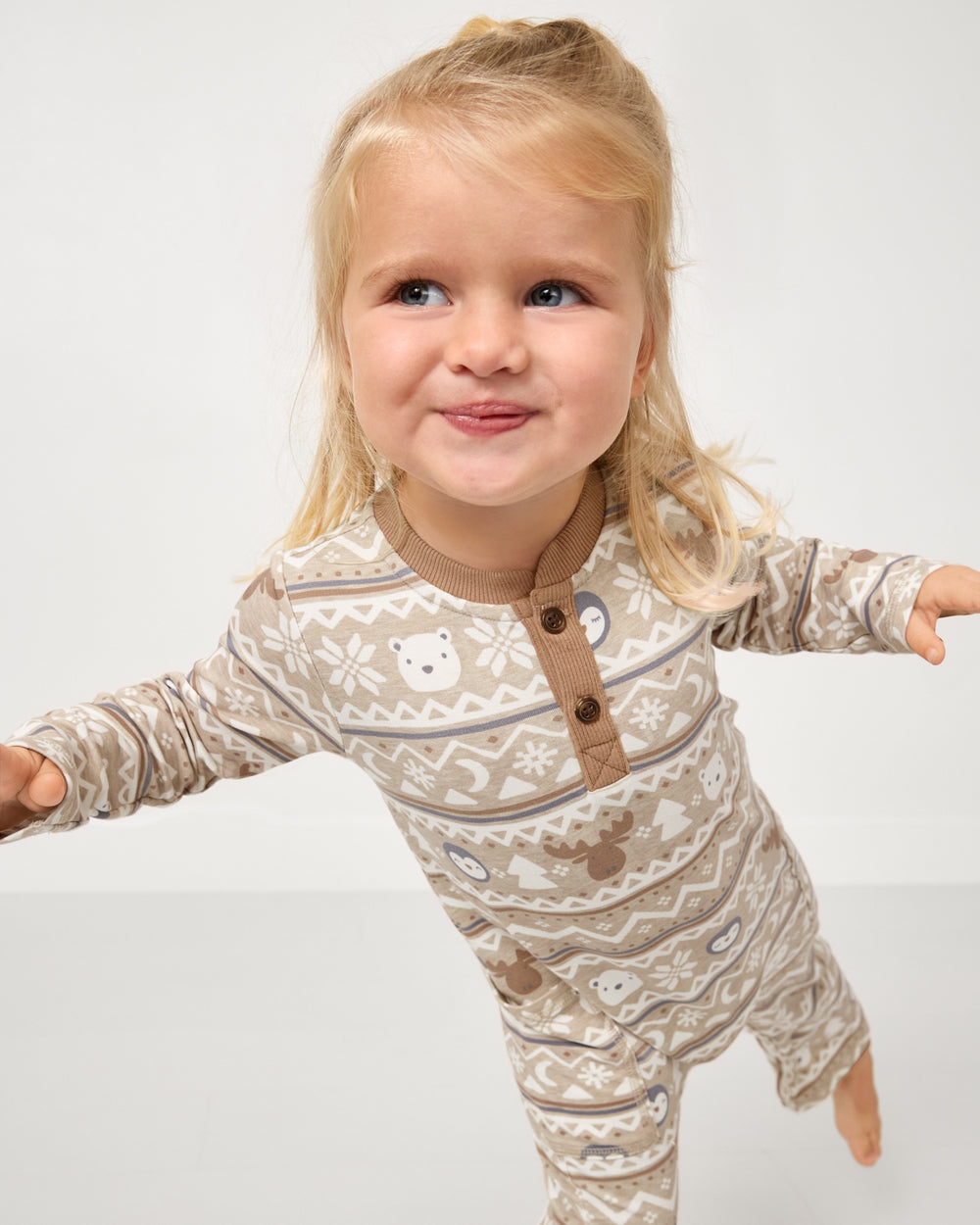 Close up of girl wearing the Frosty Fair Isle Henley Romper