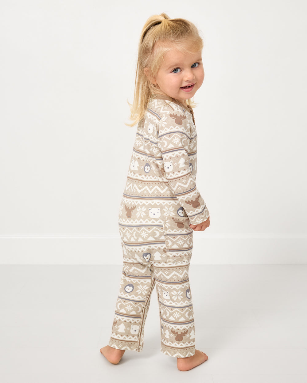 Back view of girl wearing the Frosty Fair Isle Henley Romper