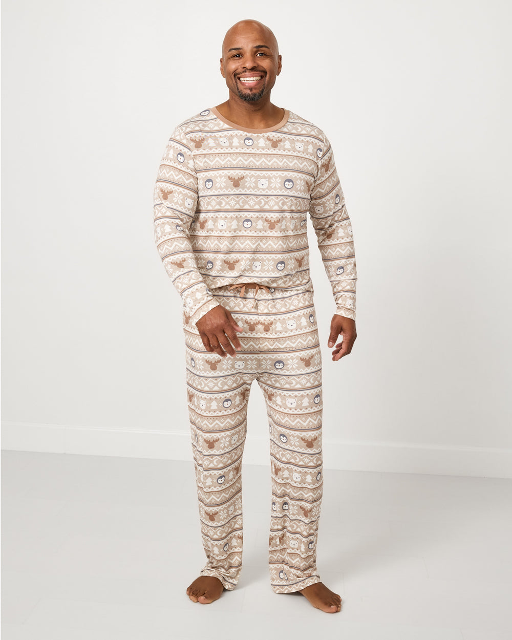Man wearing the Frosty Fair Isle Men's Pajama Pants and Top