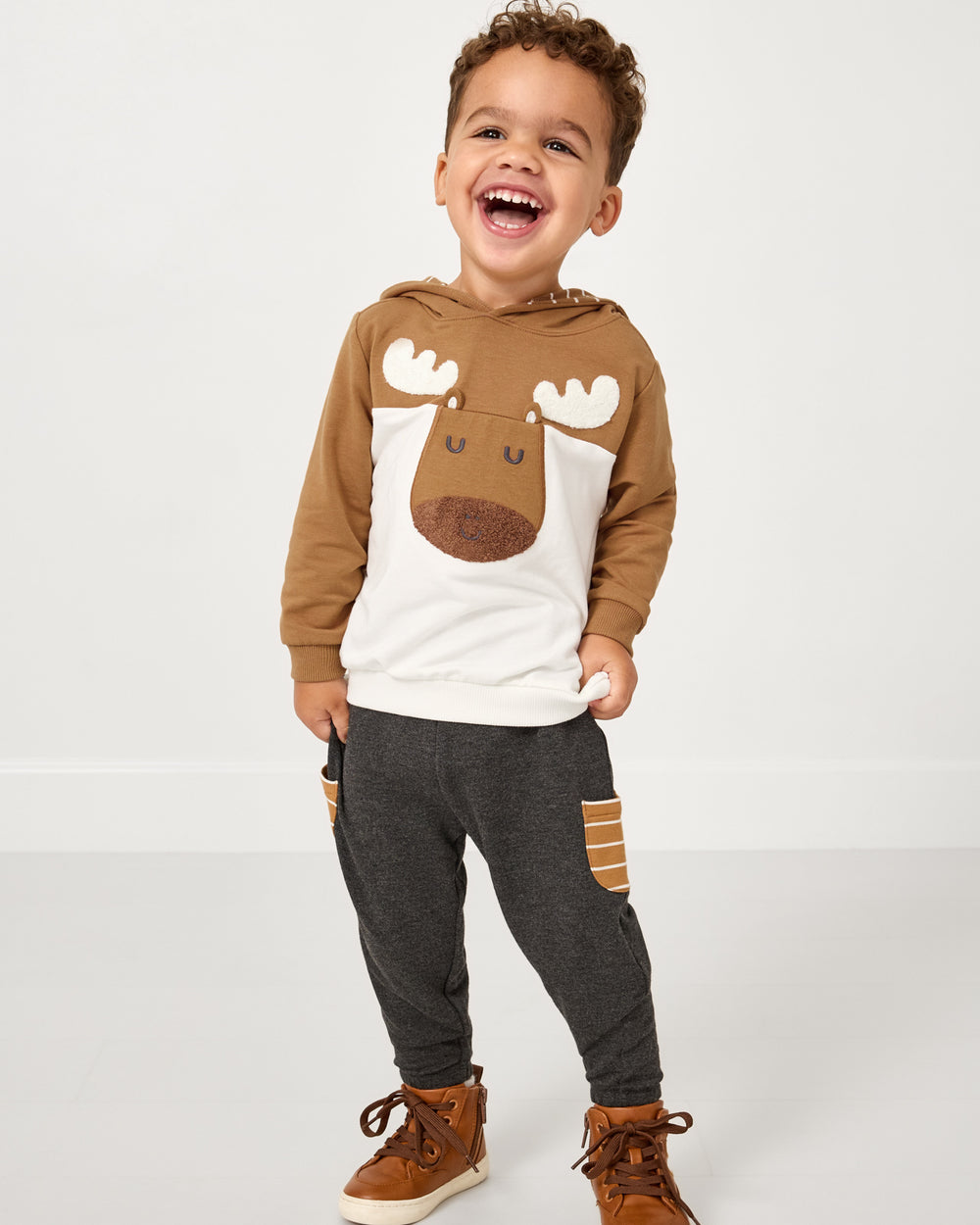 Boy wearing the Moose Pullover Hoodie with Heather Black joggers