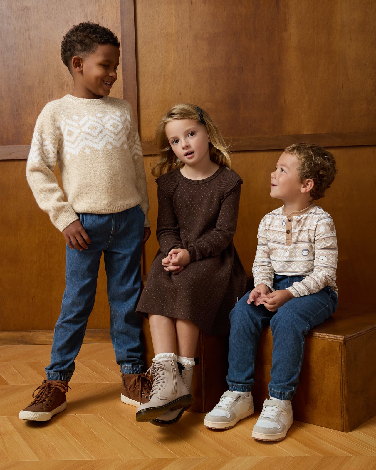 Three children wearing styles from the Winter Play collection