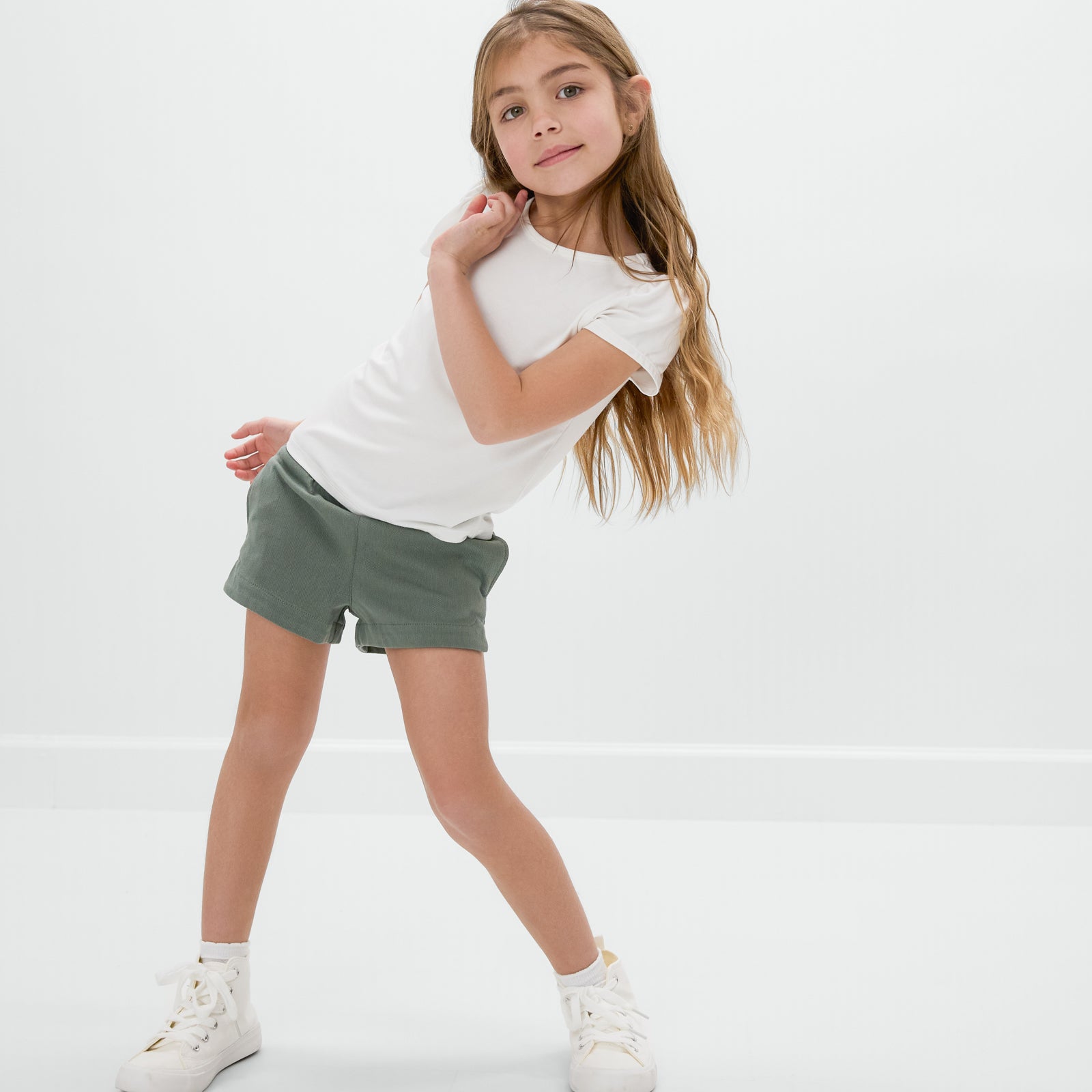 Child wearing the Fern Denim Shorts and a white white tee