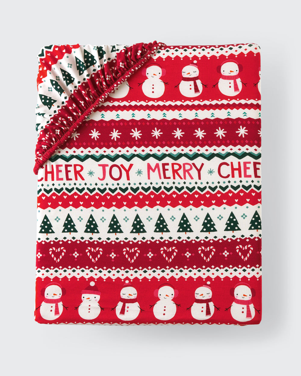 Flat lay of the Festive Fair Isle Fitted Crib Sheet
