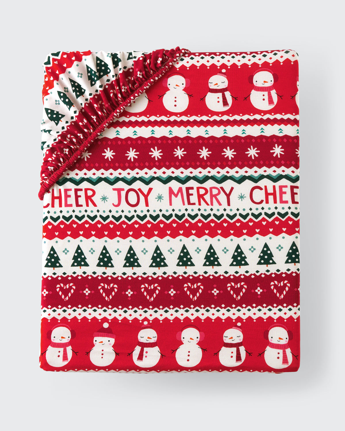 Flat lay of the Festive Fair Isle Fitted Crib Sheet