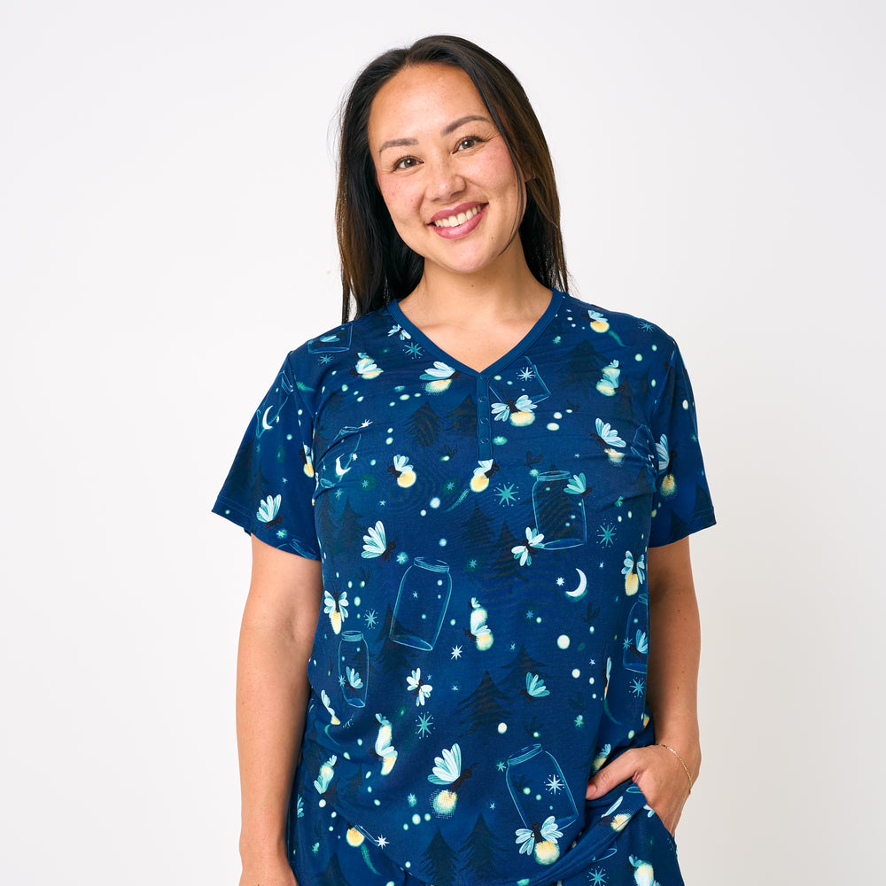 Standing woman wearing the Firefly Glow Women's Short Sleeve Pajama Top