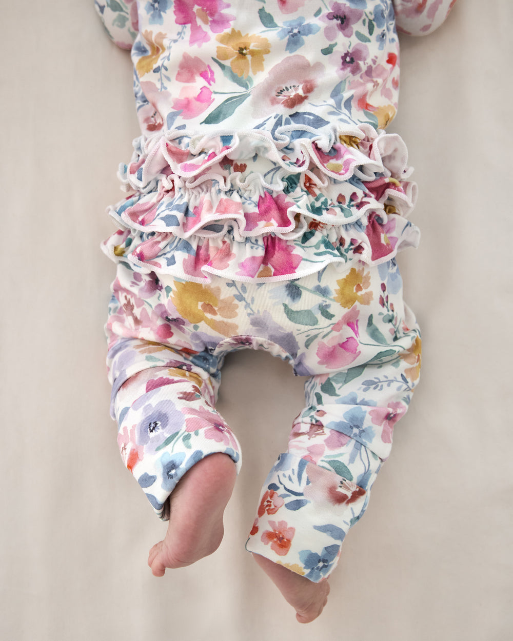 Close up of the ruffle detail on the Tiny Blooms Ruffle Zippy