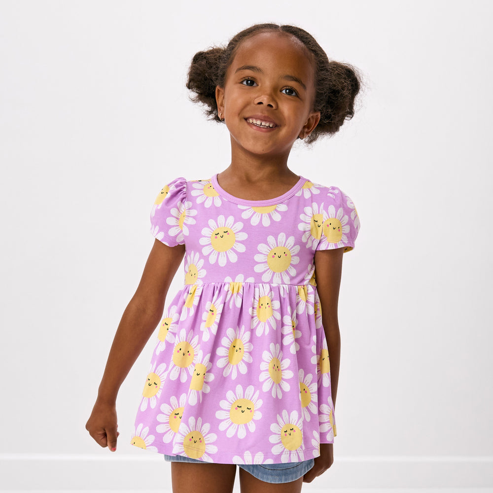 Close up of child wearing the Flower Power Empire Tunic Top