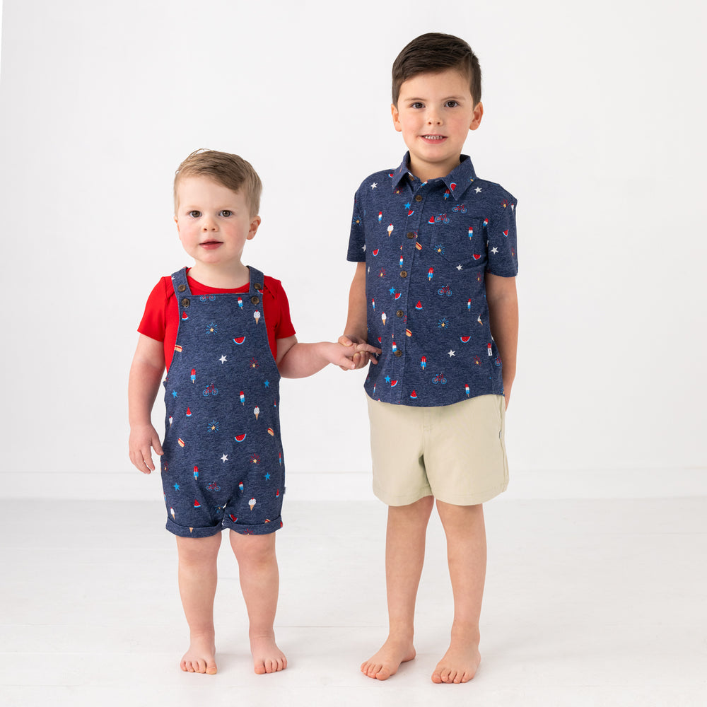 Two children wearing matching Summer Celebrations play styles