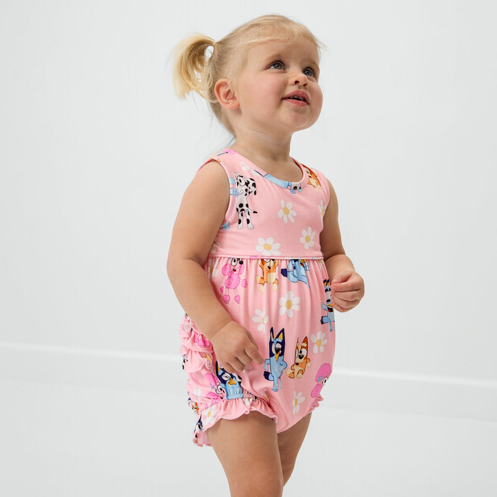 Standing toddler wearing the Bluey Garden Games Bubble Romper