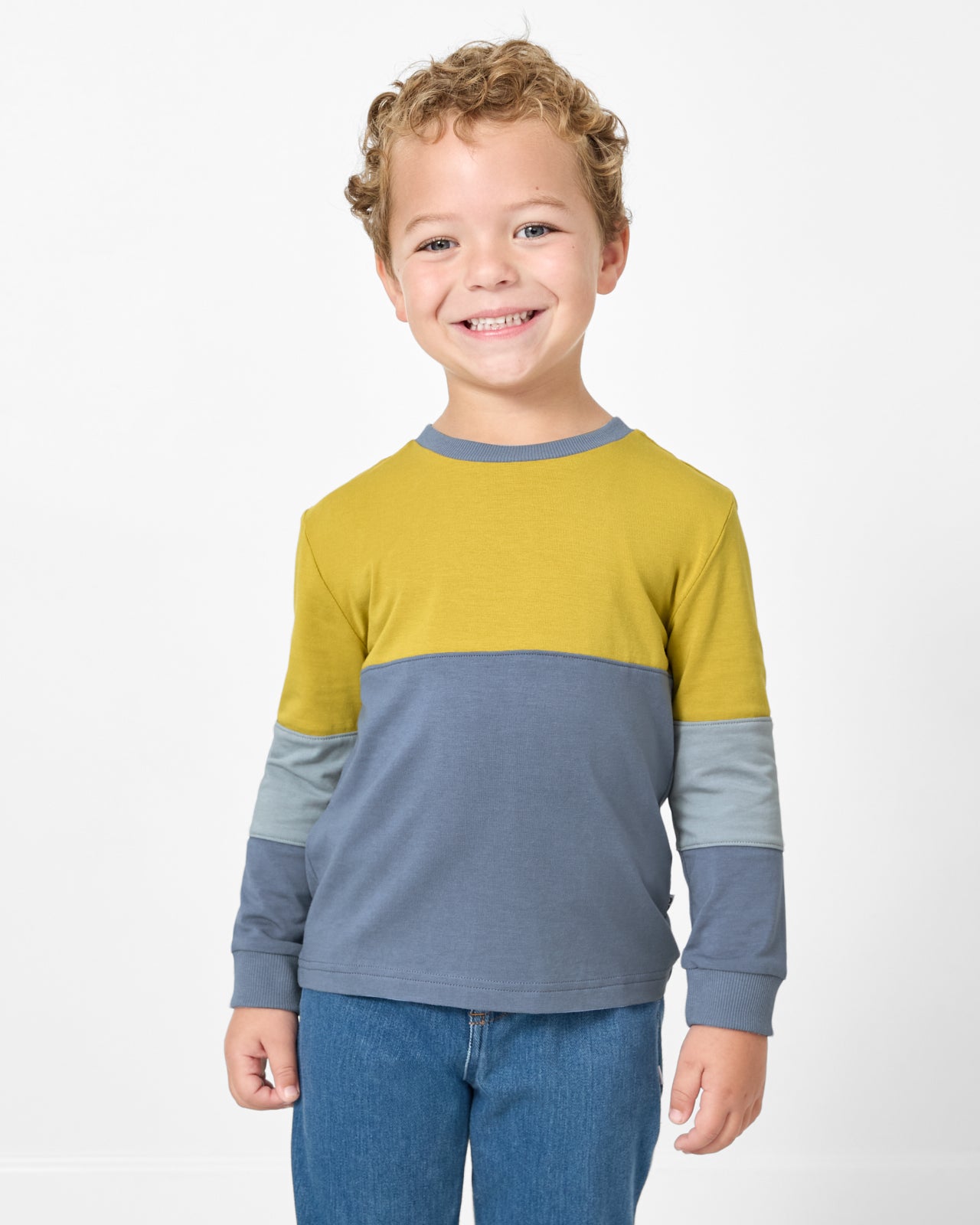 Front view of boy wearing the Golden Moss Paneled Tee