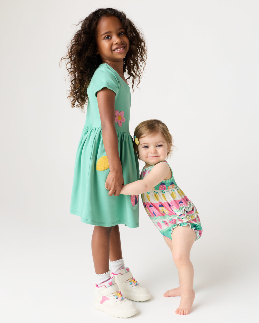 Two kids wearing Play styles from the Spring Capsule