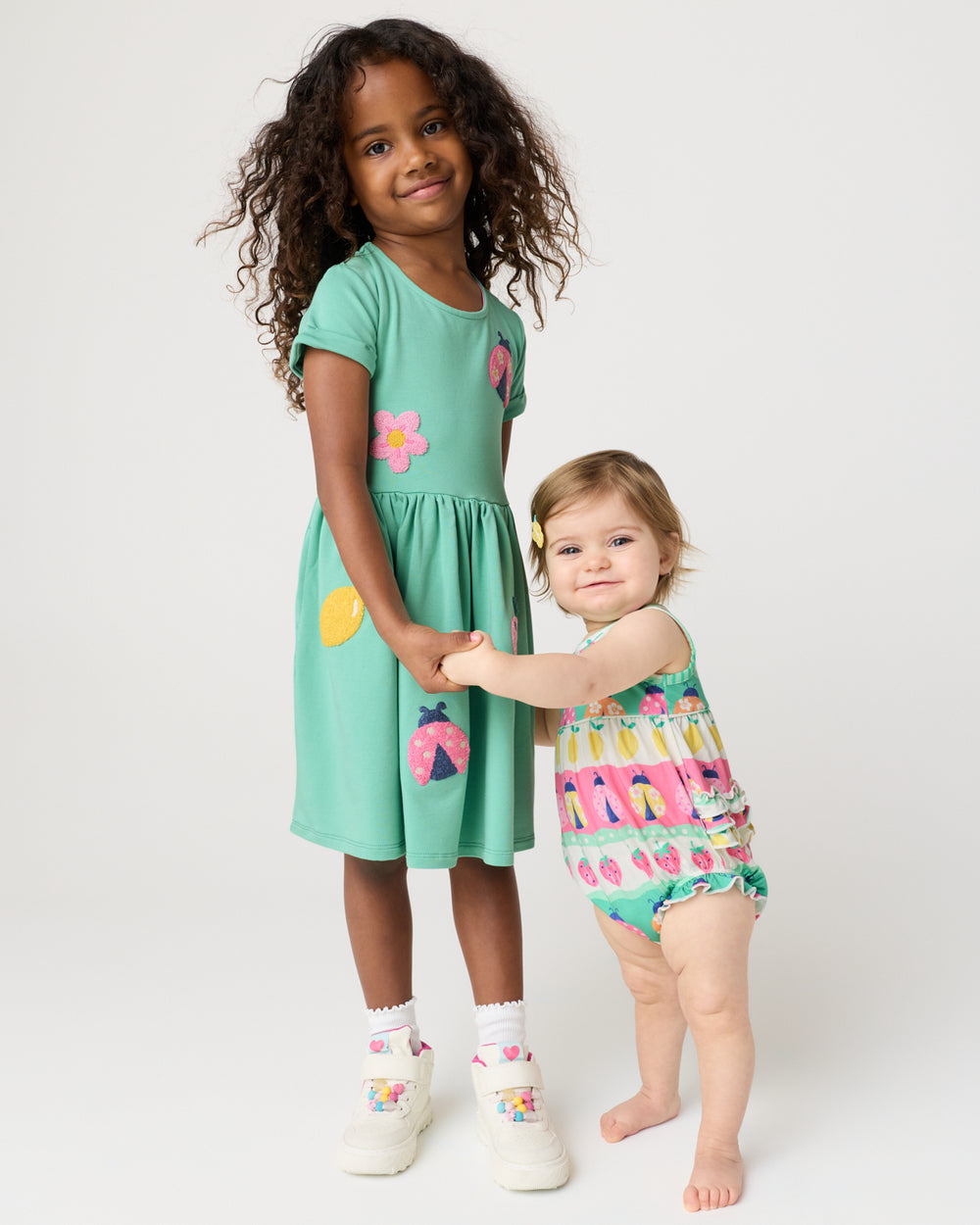 Two children wearing Spring Play Capsule styles