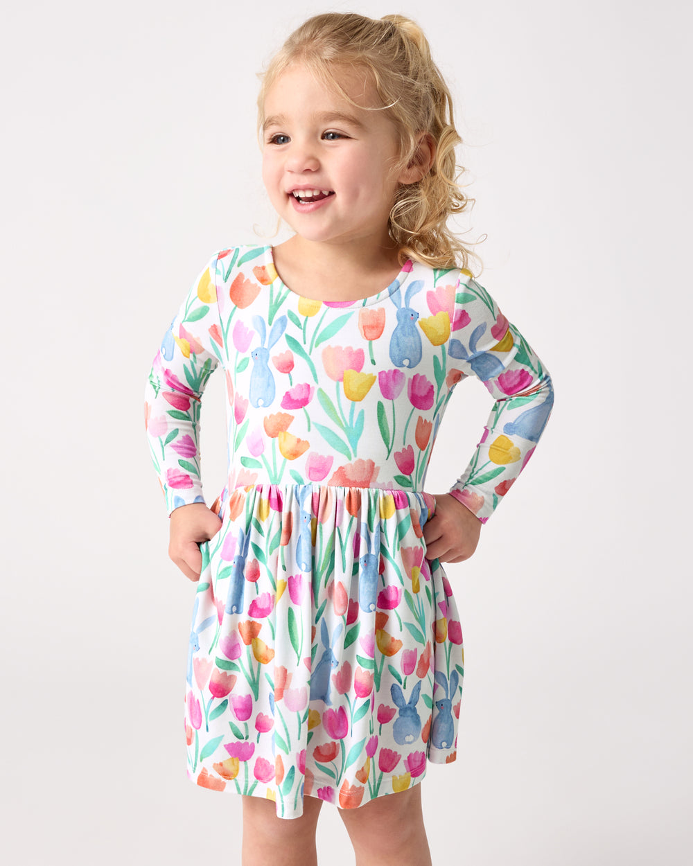 Girl wearing the Garden Hop Bow Back Skater Dress