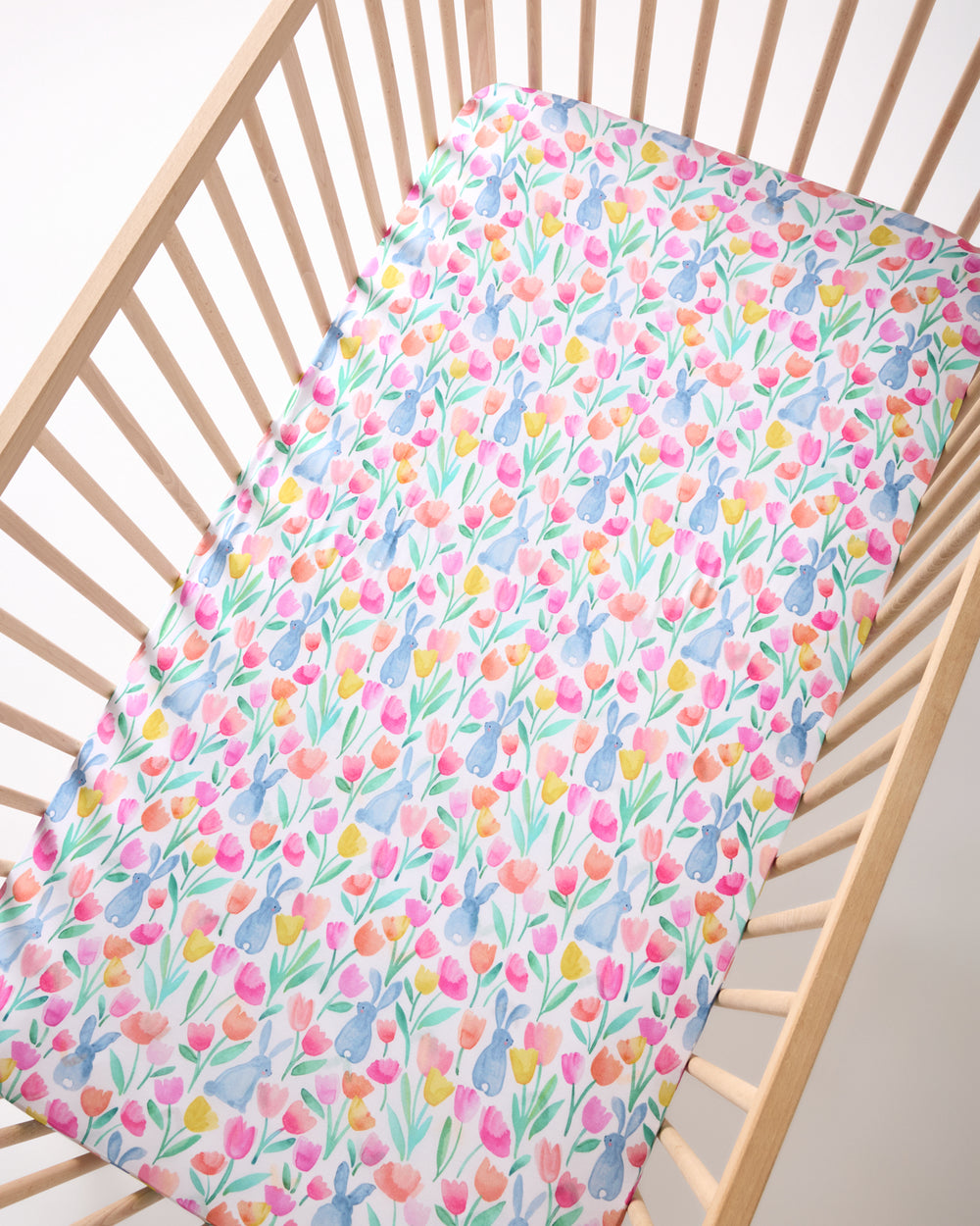 Overhead view of the Garden Hop Fitted Crib Sheet