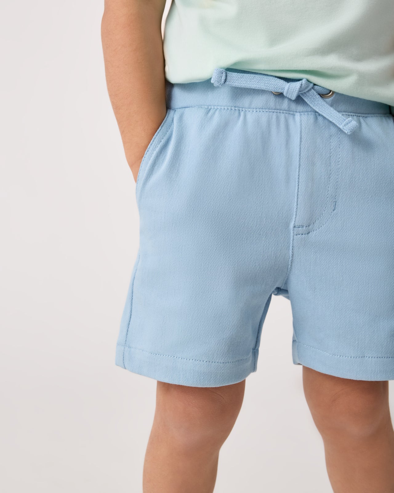 Close up of child wearing the Gentle Blue Chino Shorts