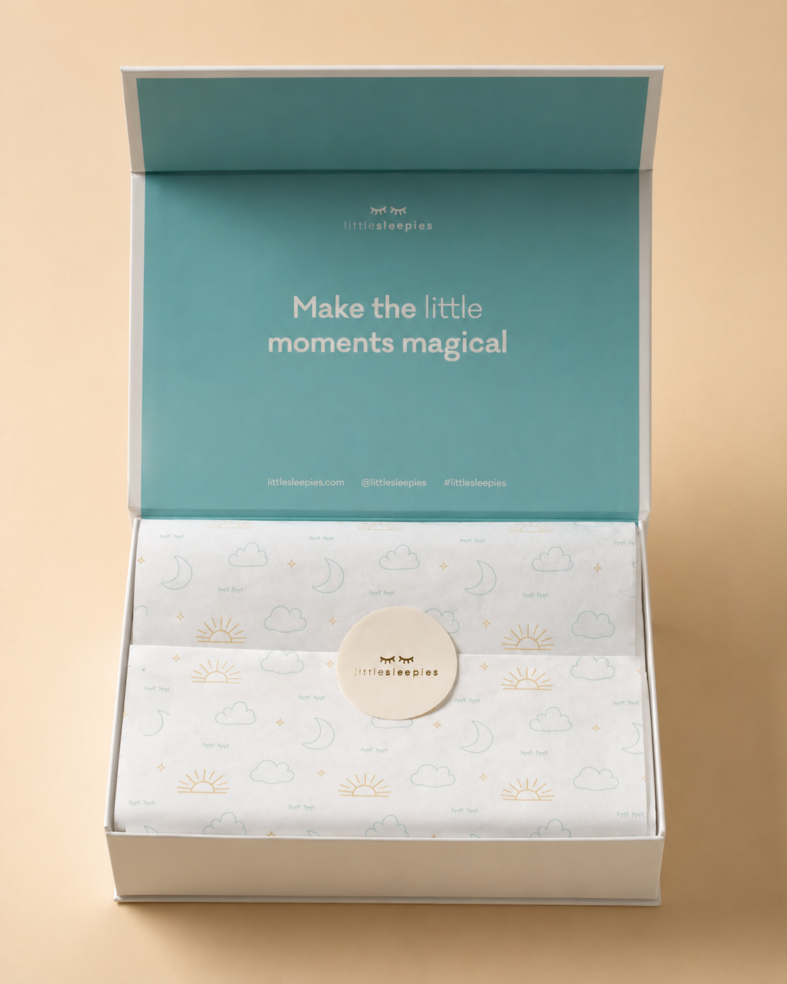 Product packaging with a teal lid and beige base, featuring text and a brand logo.