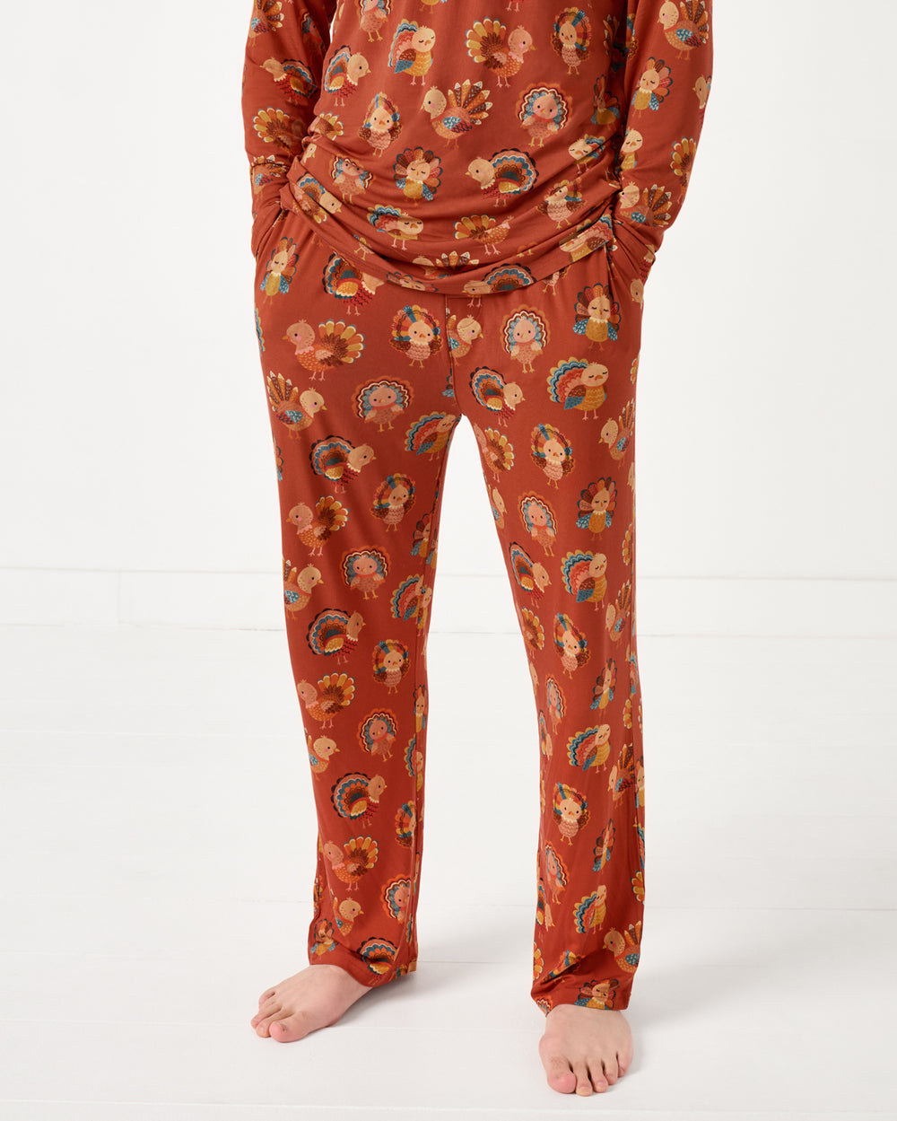 Standing man wearing the Grateful Gobbles Men's Pajama Pants