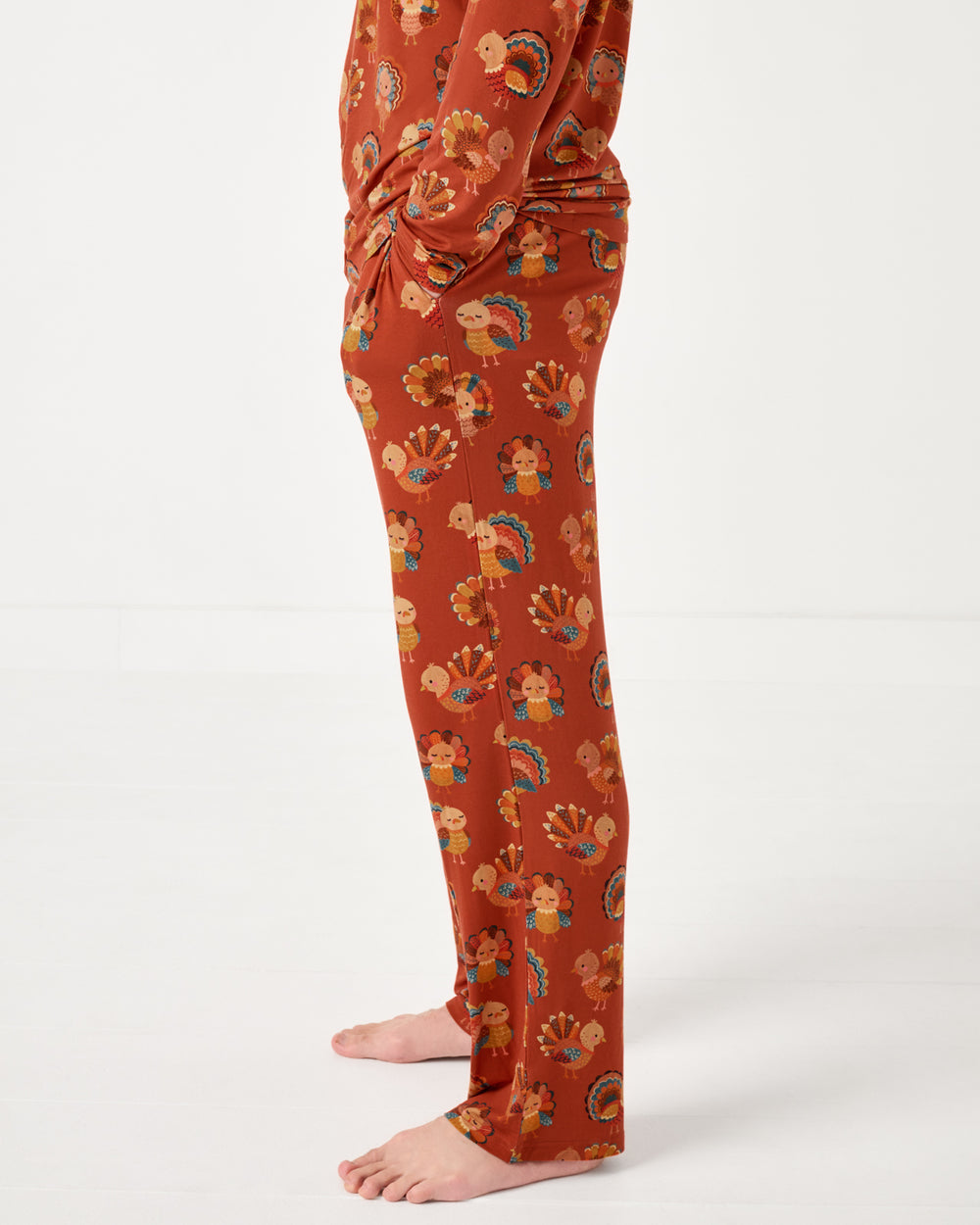 Side view of man wearing the Grateful Gobbles Men's Pajama Pants