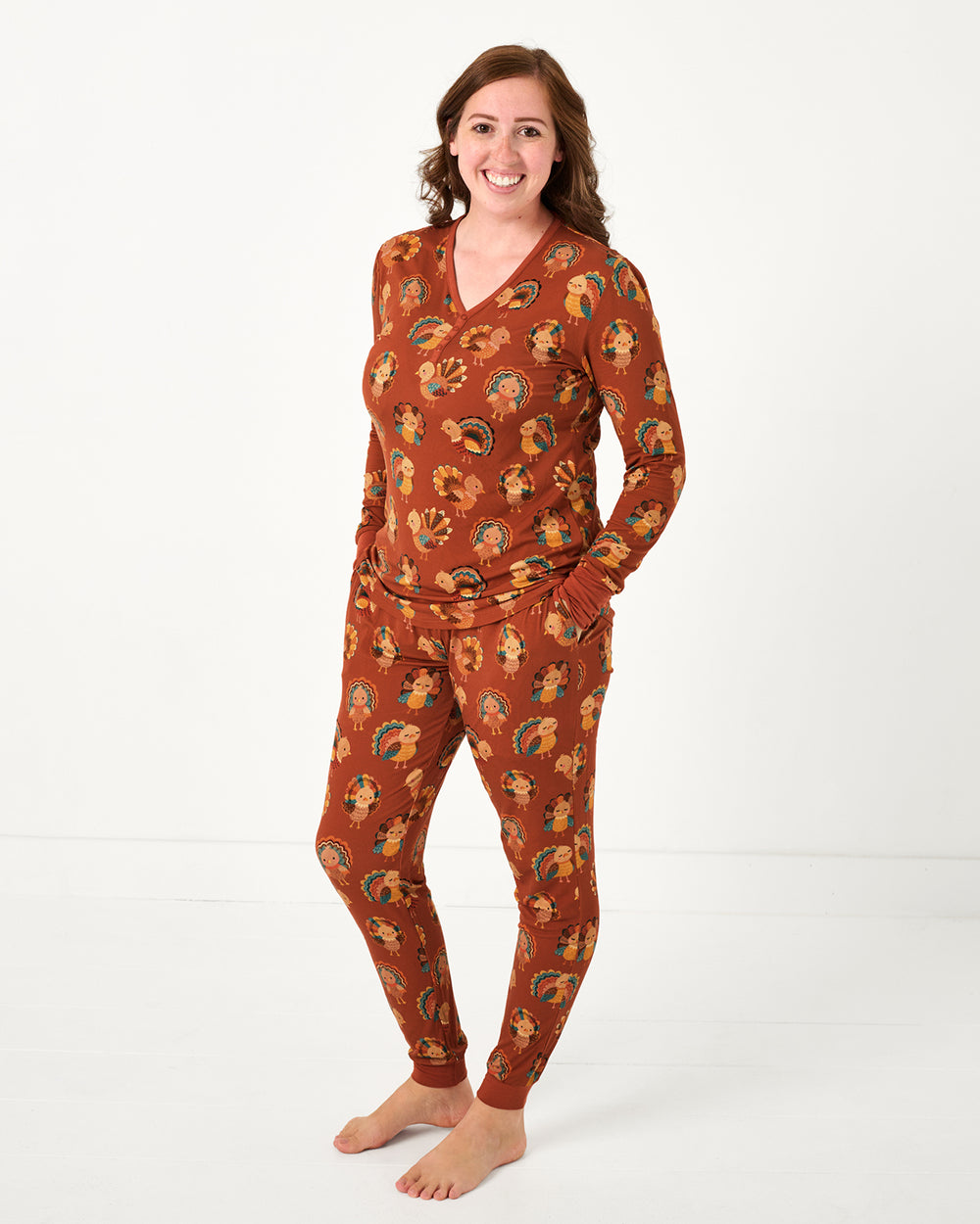 Woman wearing the Grateful Gobbles Women's Long Sleeve Pajama Top and Pants