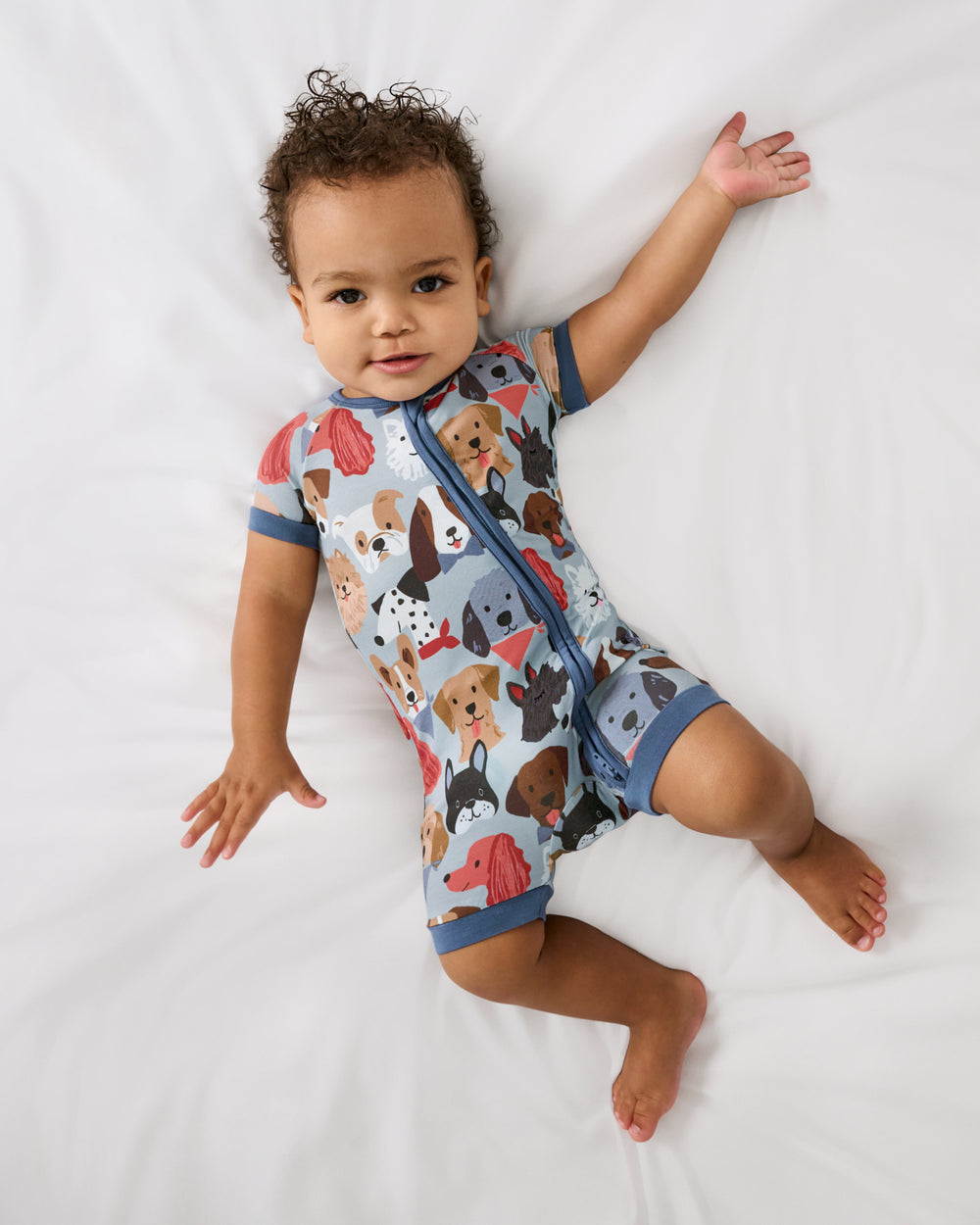 Aerial view of baby wearing the Gray Puppy Parade Shorty Zippy