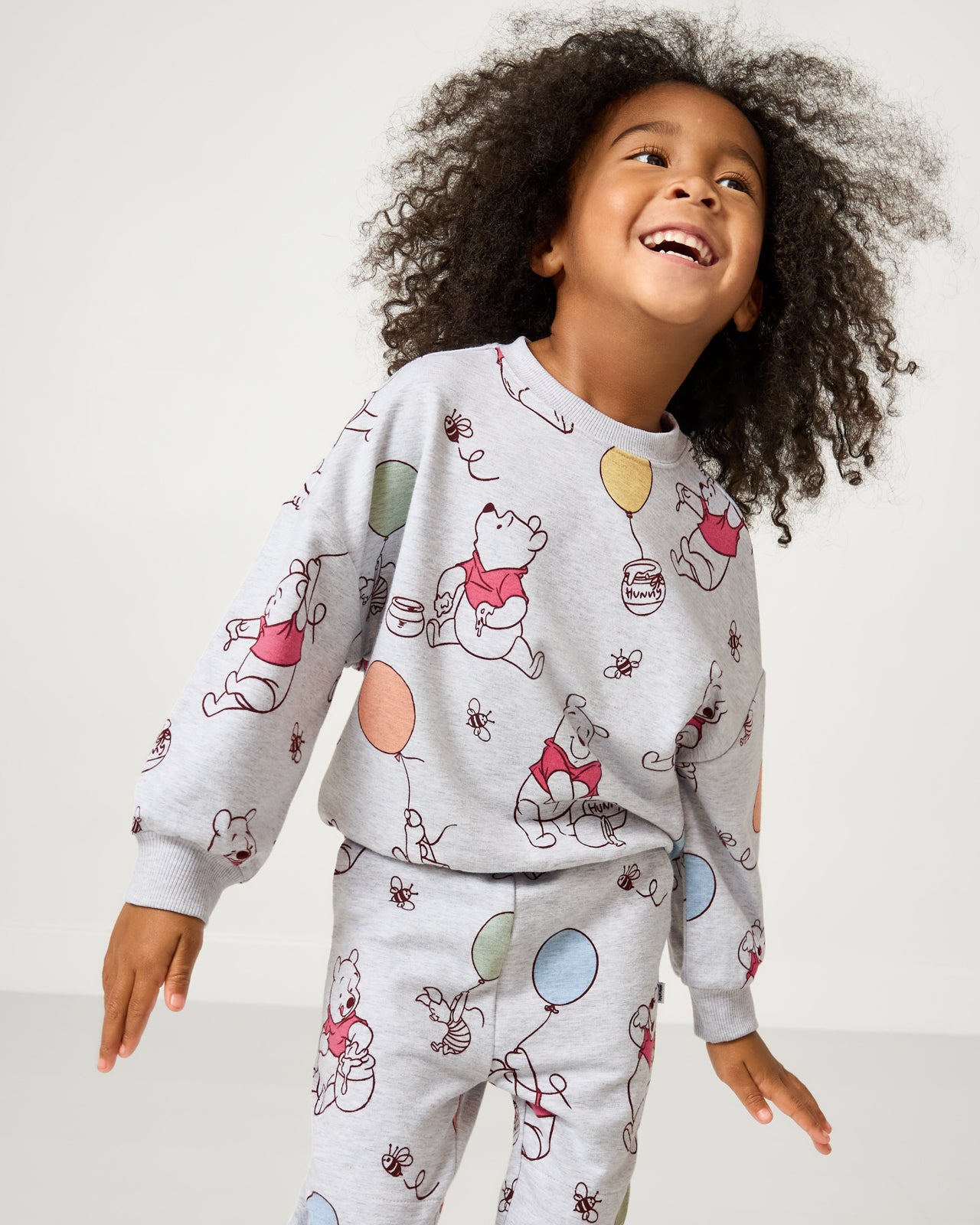 Girl wearing the Disney Up, Up and Away Drop Shoulder Crewneck