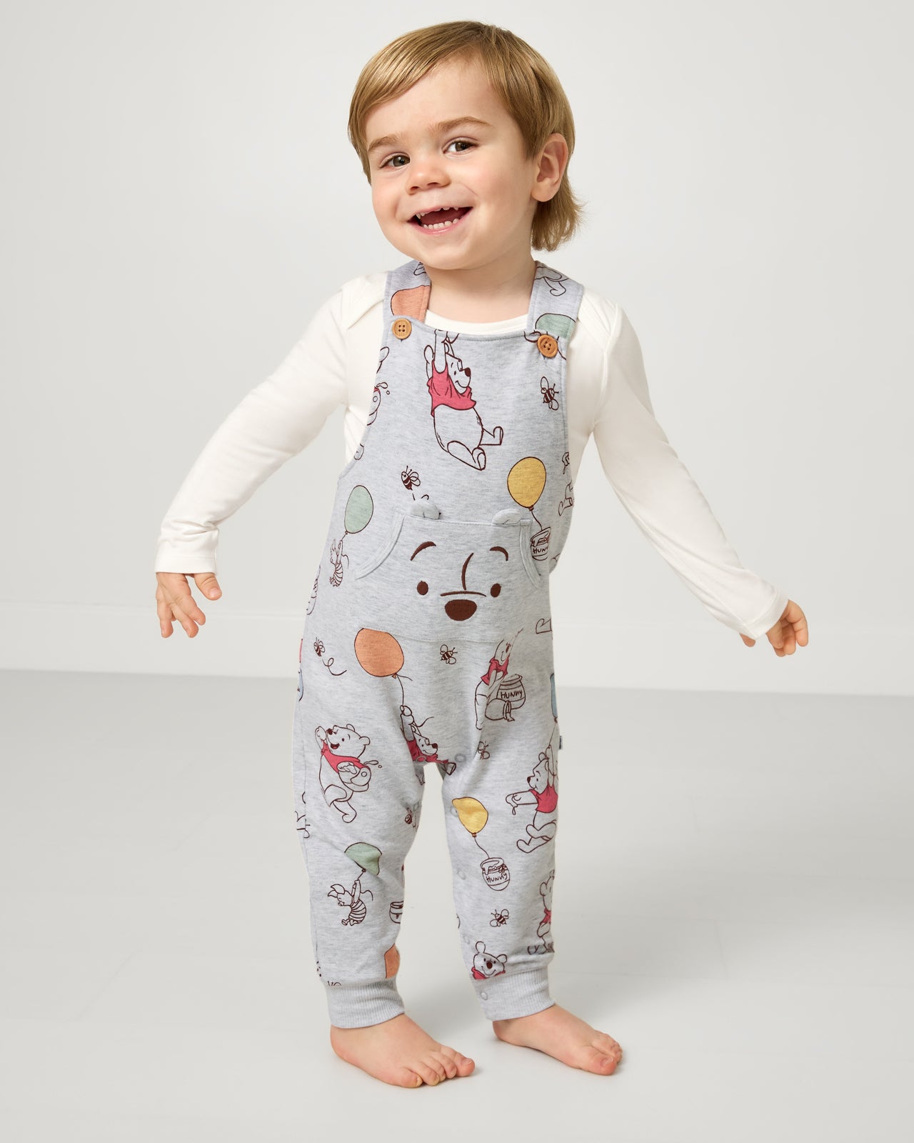 Boy wearing the Disney Up, Up and Away Overall