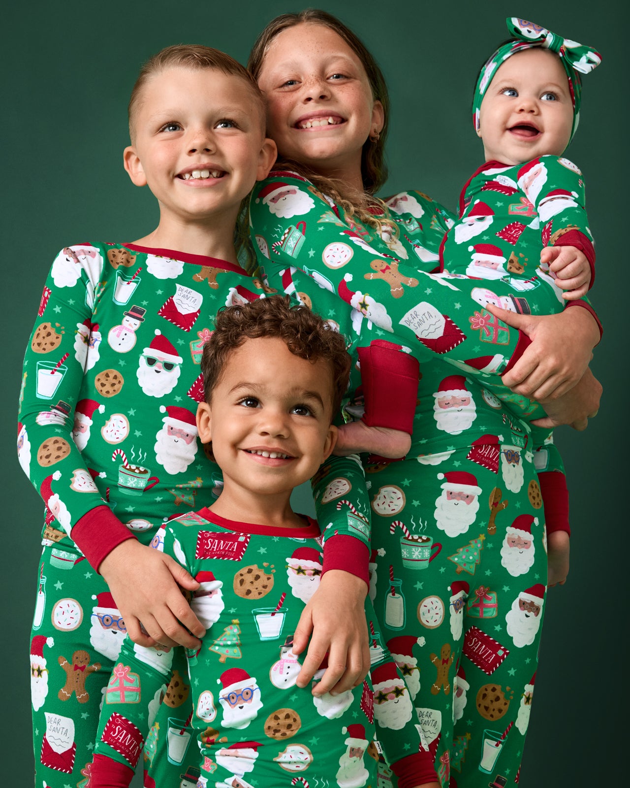 Group of four kids wearing Cookies for Santa PJs