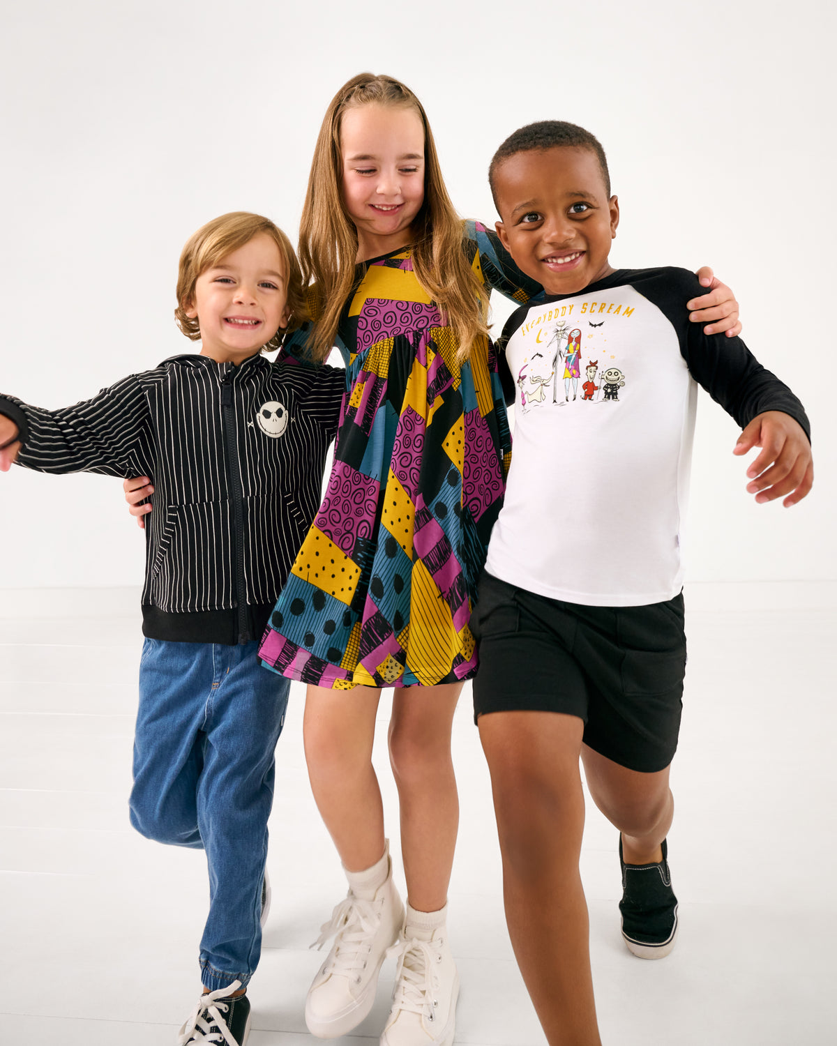 Three children wearing styles from the Halloween Collection