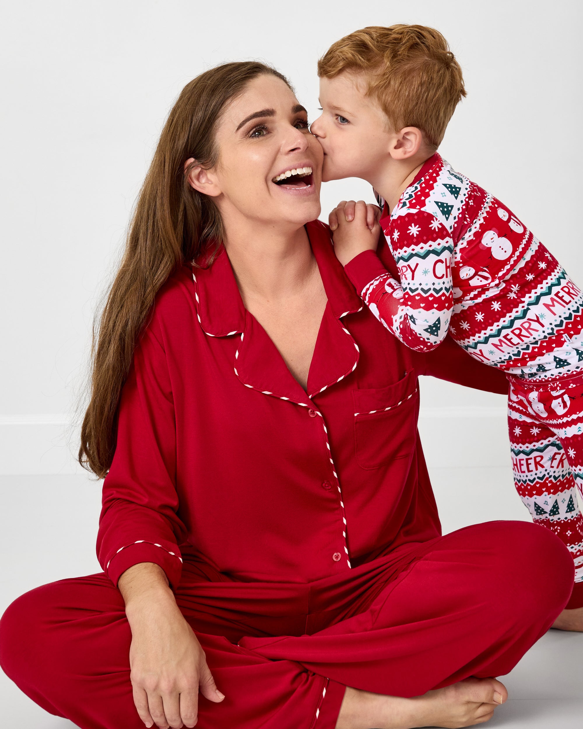 Mother and son wearing pajamas from the Little Sleepies Holiday Collection