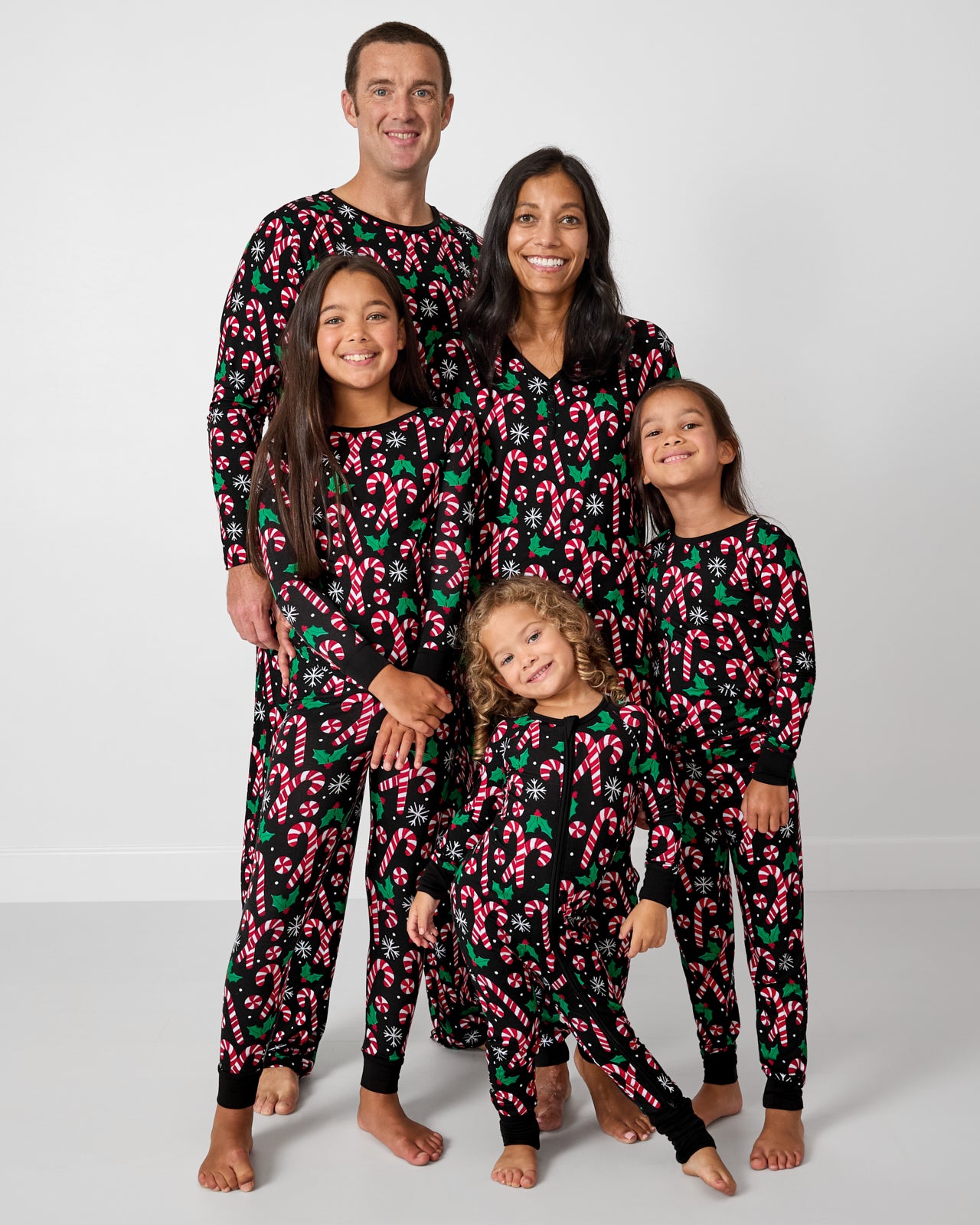 Family of five wearing matching Merry Mints holiday pajamas