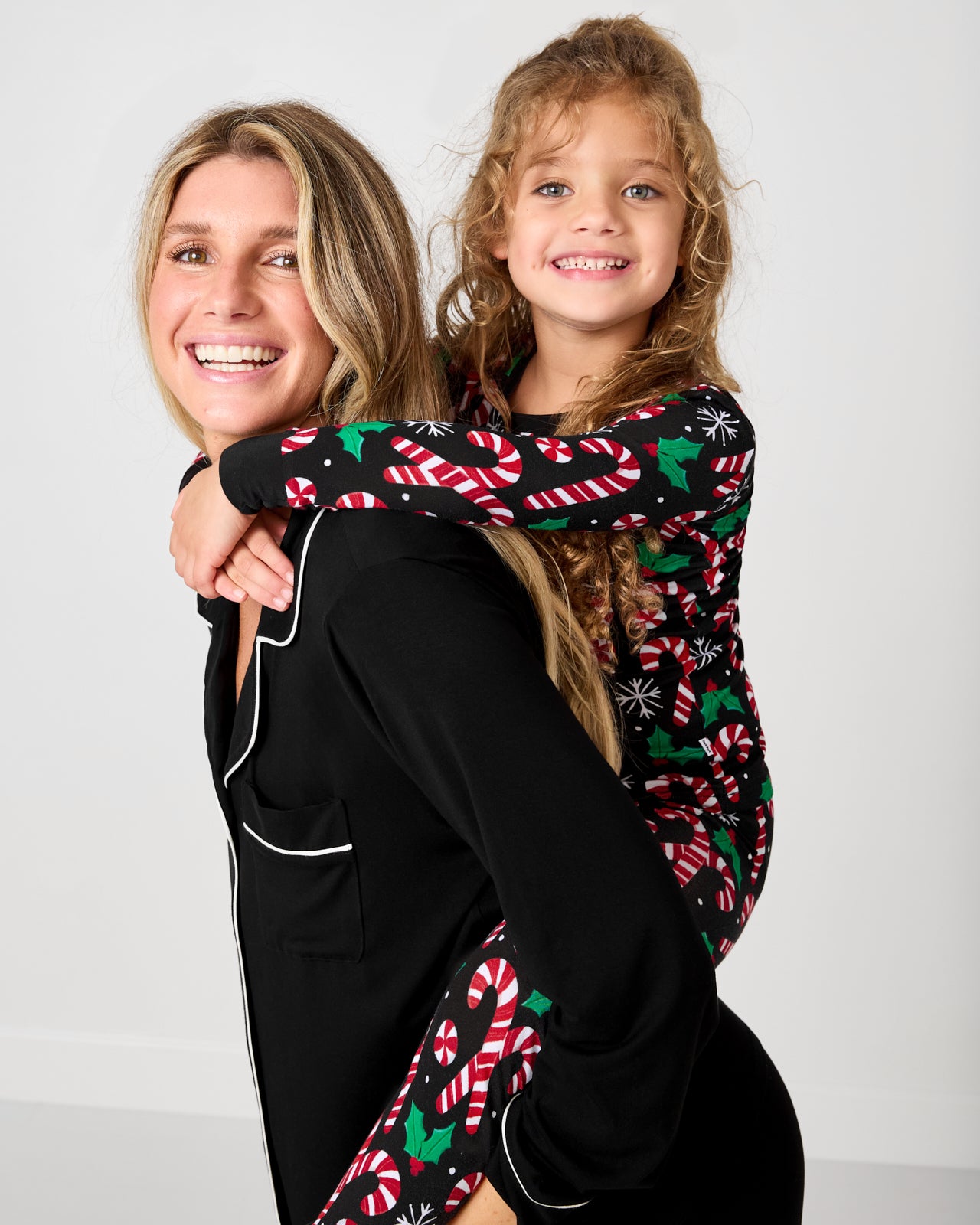 Mother and daughter wearing pajamas from the holiday collection