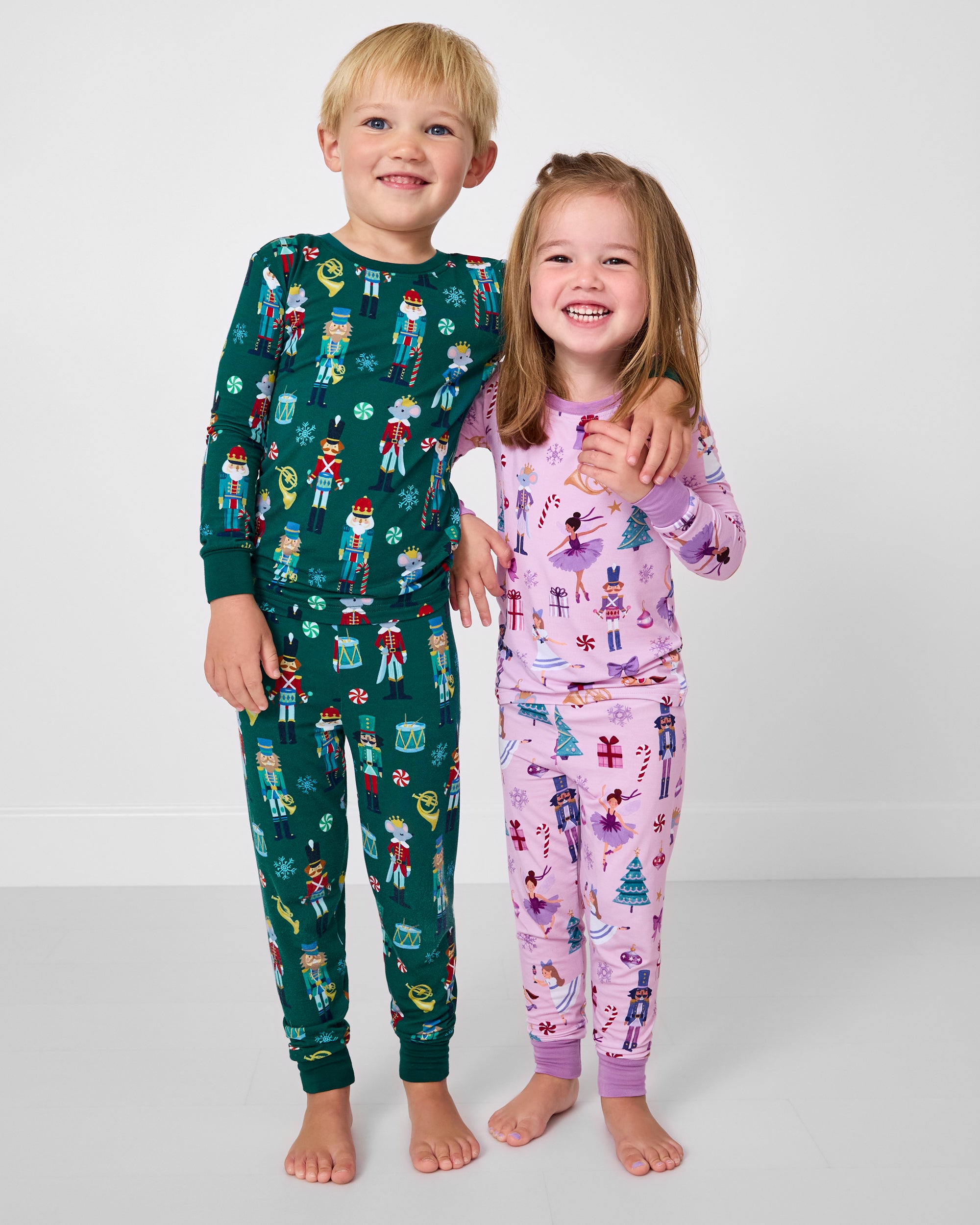 Two children wearing matching Nutcracker Ballet and Nutcracker March Two-Piece Pajama Sets