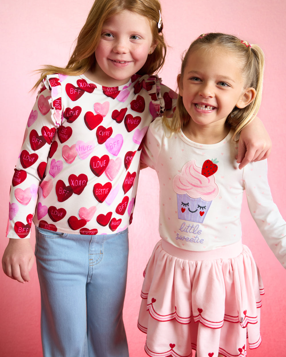 Close up of two girls wearing styles from the Valentines Day drop