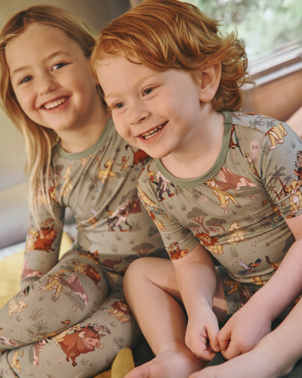 Alternate of two children wearing matching Disney Simba's Safari Two-Piece Pajama Sets