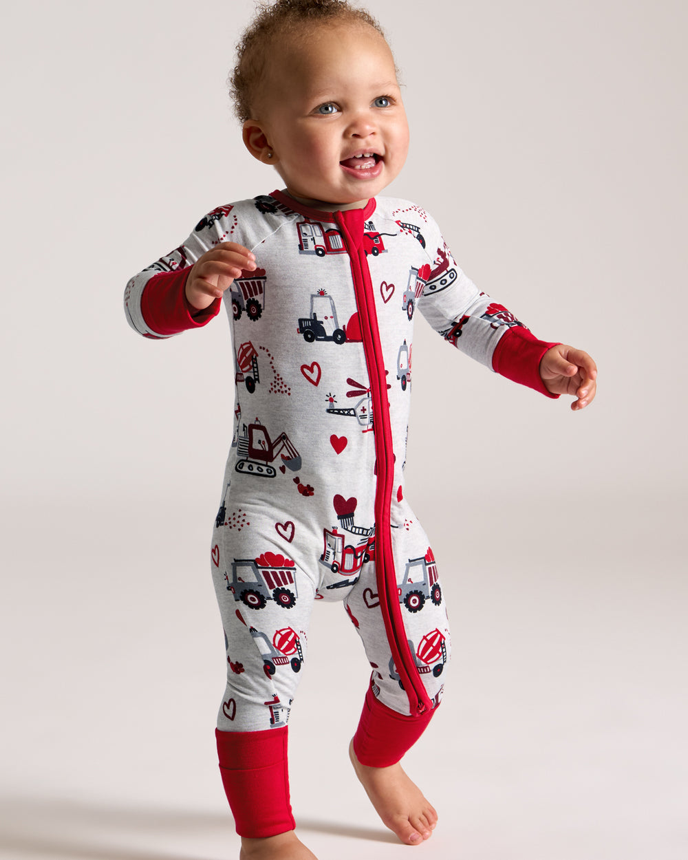 Walking toddler wearing the Loads of Love Zippy