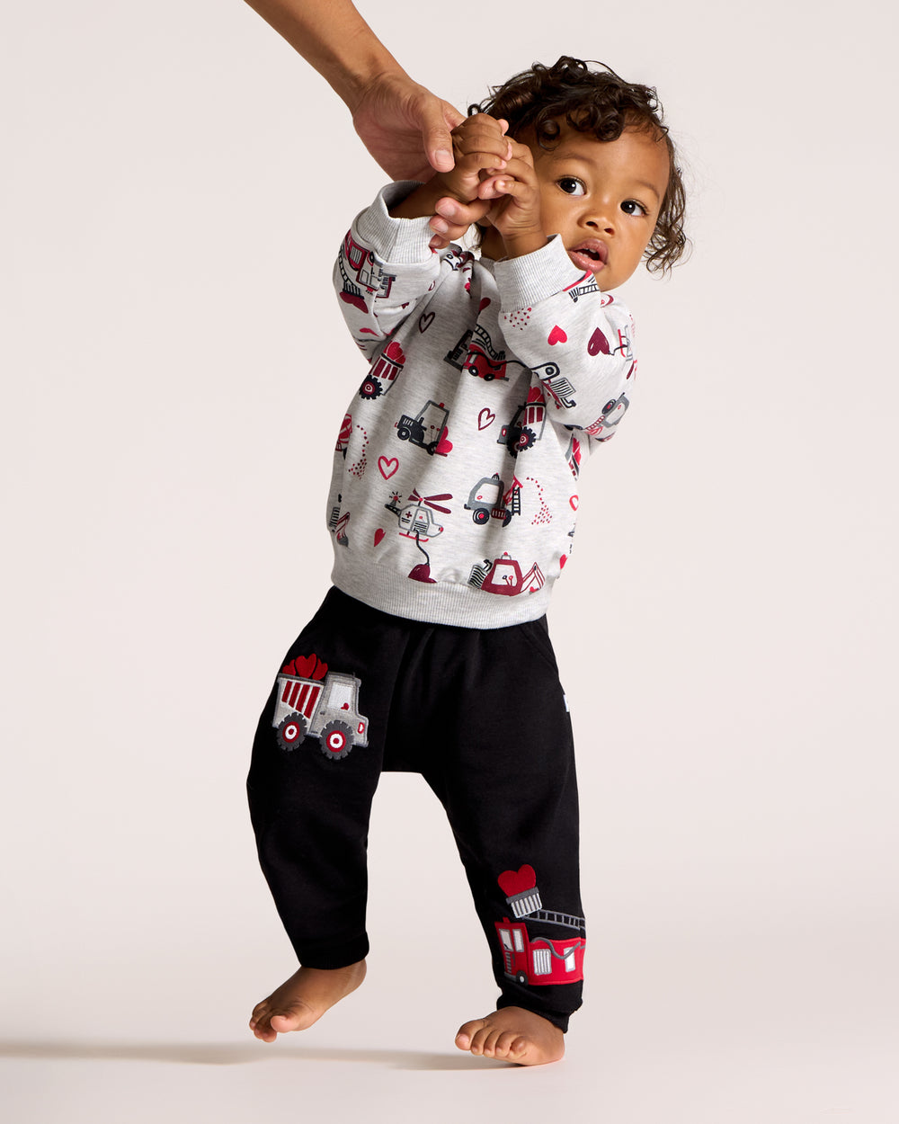 Walking toddler wearing the Loads of Love Easy Jogger