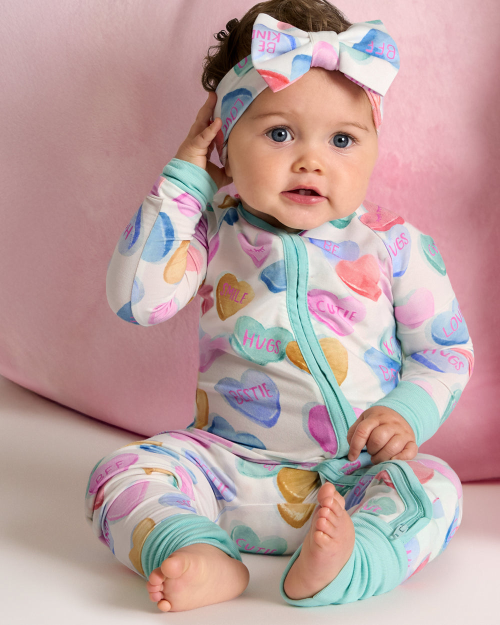 Baby wearing the Candy Cuties Luxe Bow Headband