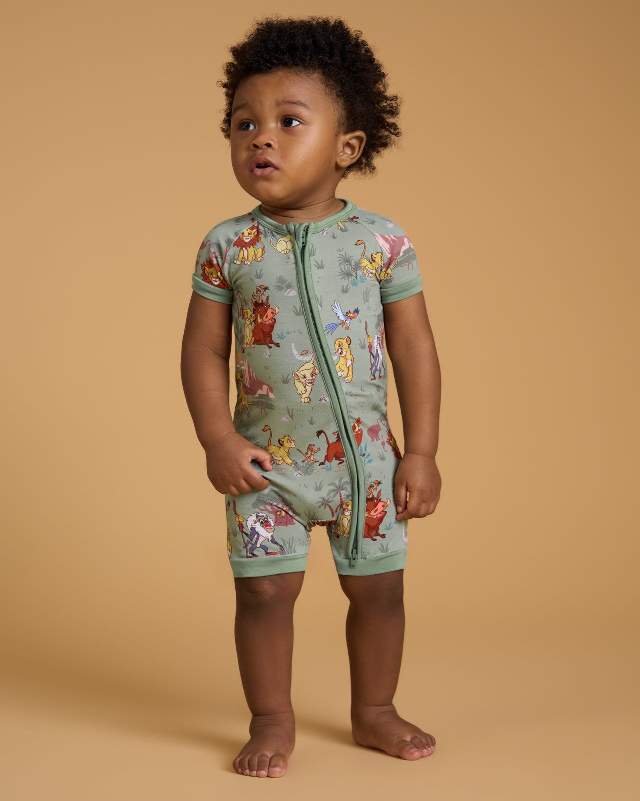 Standing toddler wearing the Disney Simba's Safari Shorty Zippy