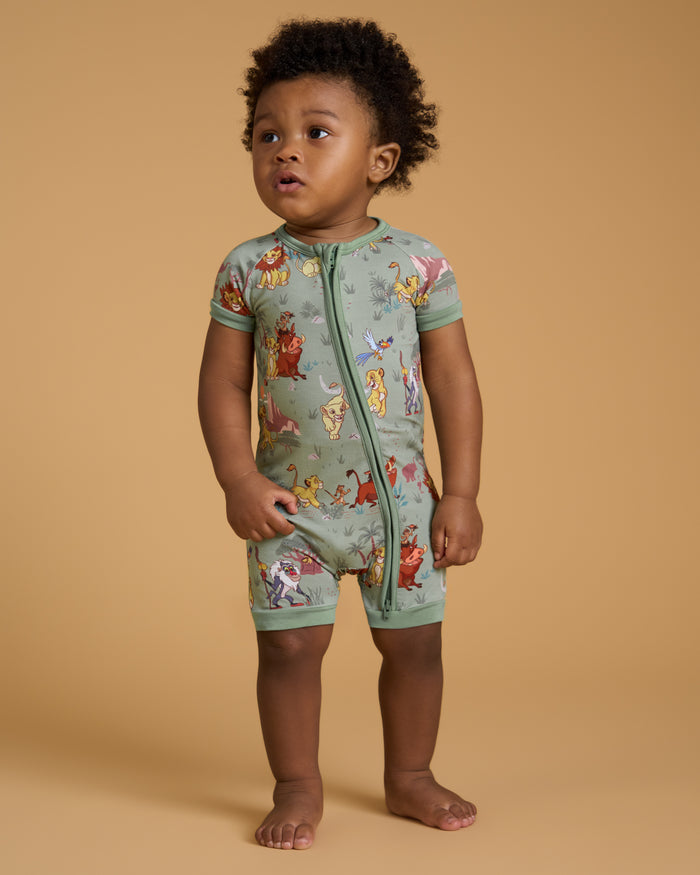 Standing toddler wearing the Disney Simba's Safari Shorty Zippy