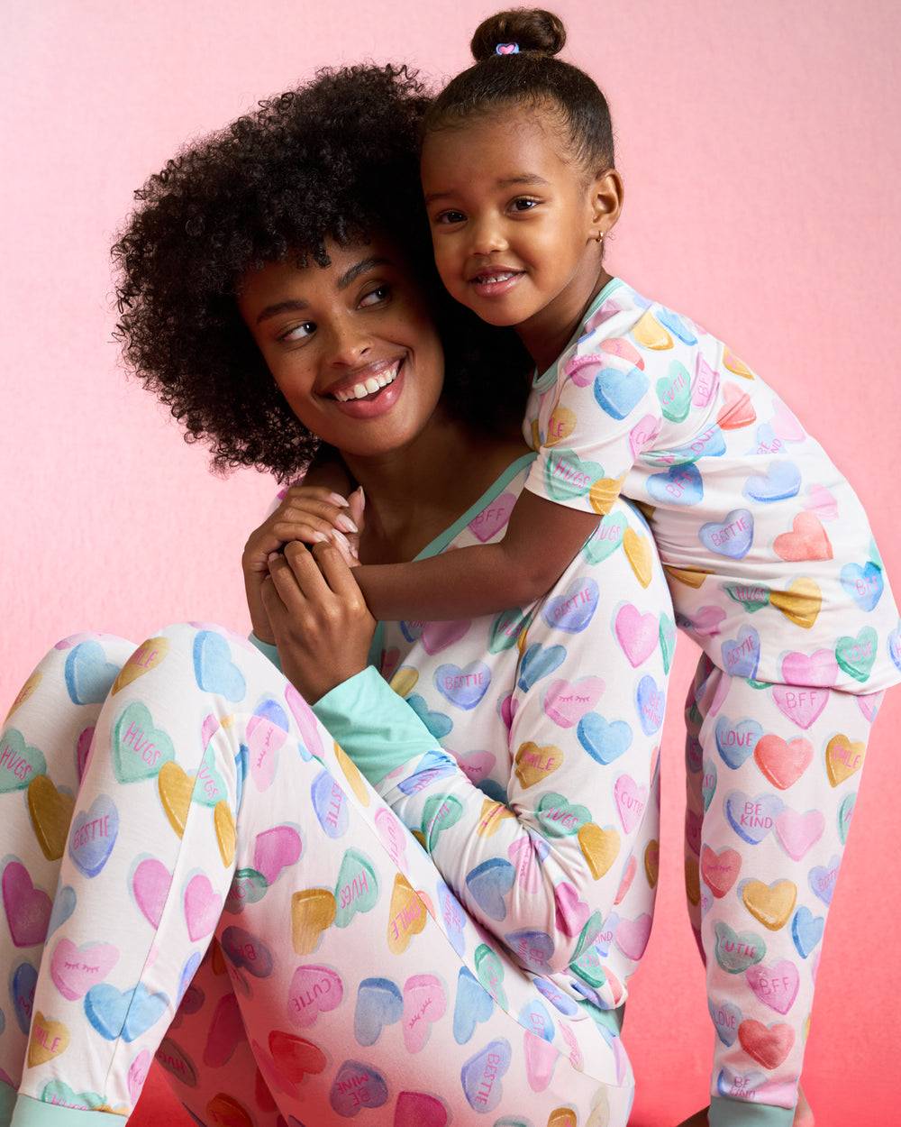 Mother and daughter wearing matching Candy Cuties Valentines Day pajamas