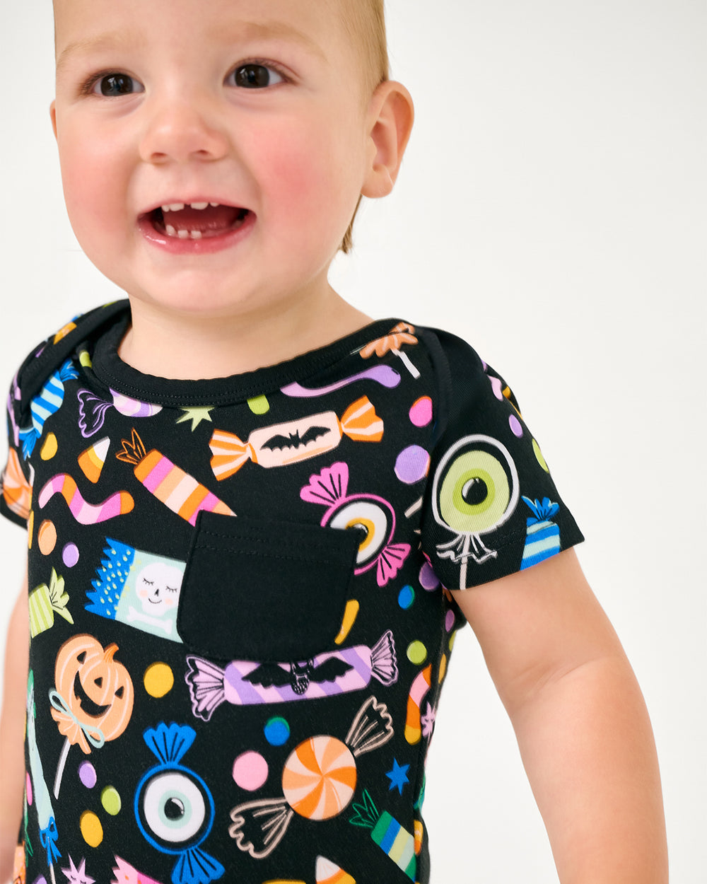 Close up of child wearing the Halloween Haul Pocket Bodysuit