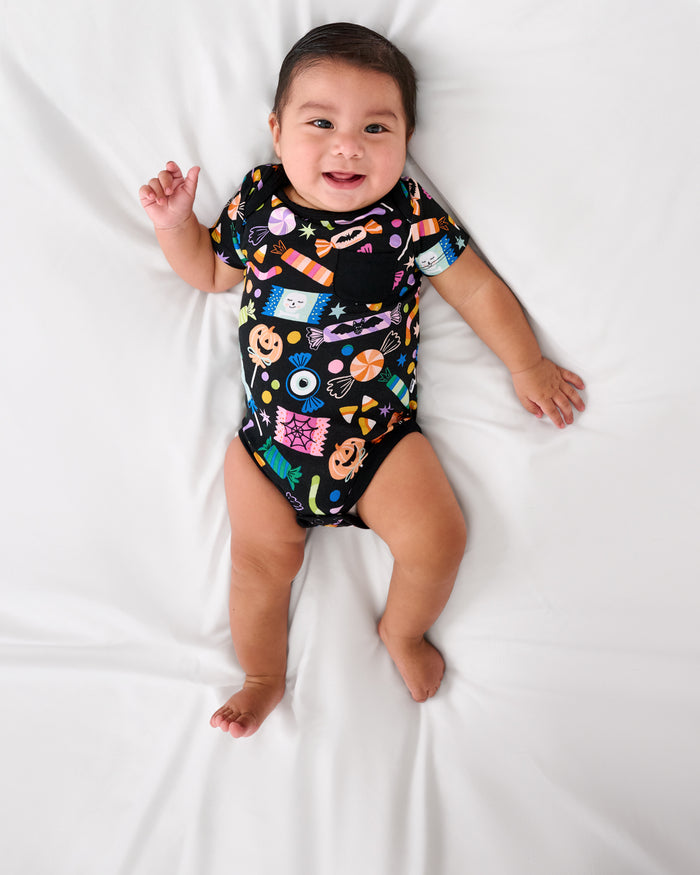Aerial view of baby wearing the Halloween Haul Pocket Bodysuit