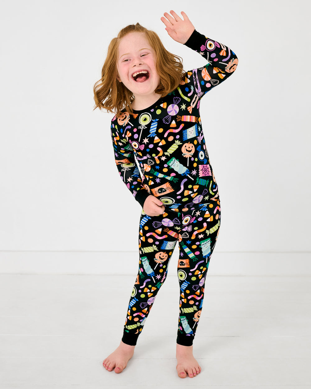 Posing girl wearing the Halloween Haul Two-Piece Pajama Set
