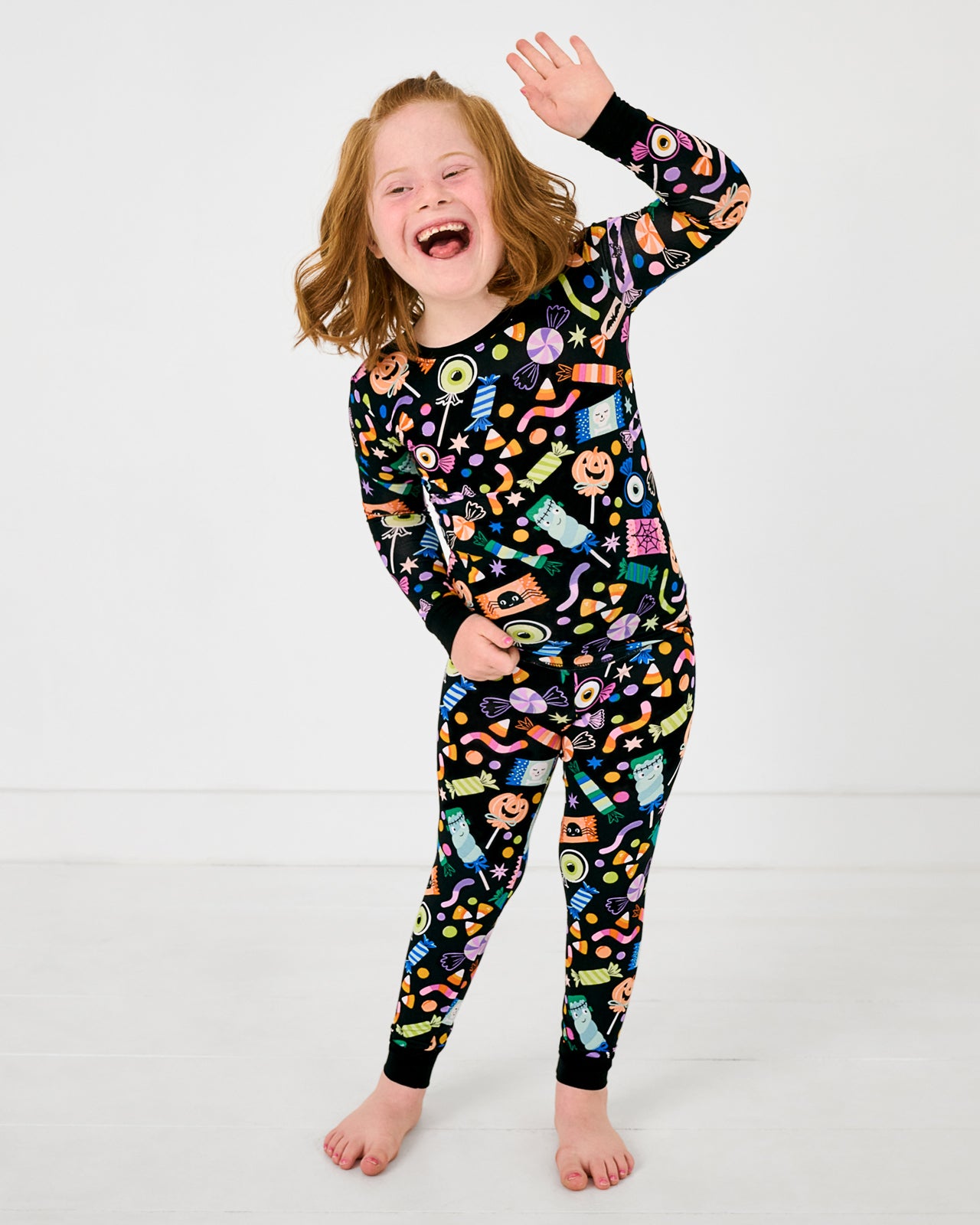 Posing girl wearing the Halloween Haul Two-Piece Pajama Set