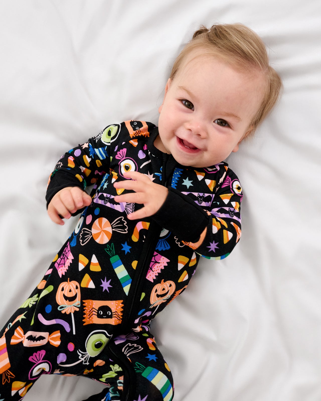 Aerial view of baby wearing the Halloween Haul Zippy