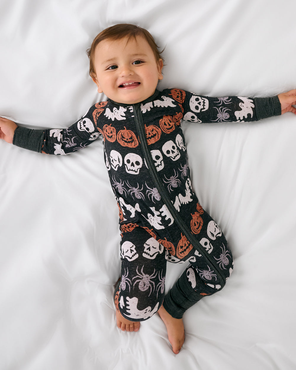 Aerial view of baby wearing the Hallows Eve Zippy