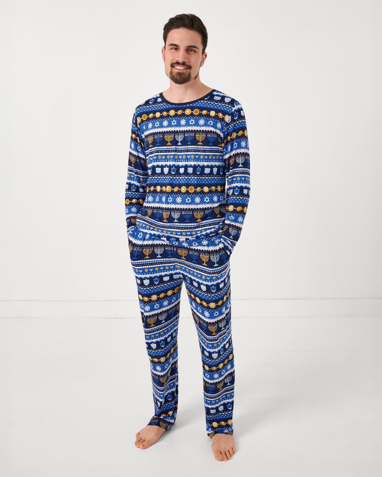 Man wearing the Hanukkah Fair Isle Men's Long Sleeve Pajama Top and matching pajama pants