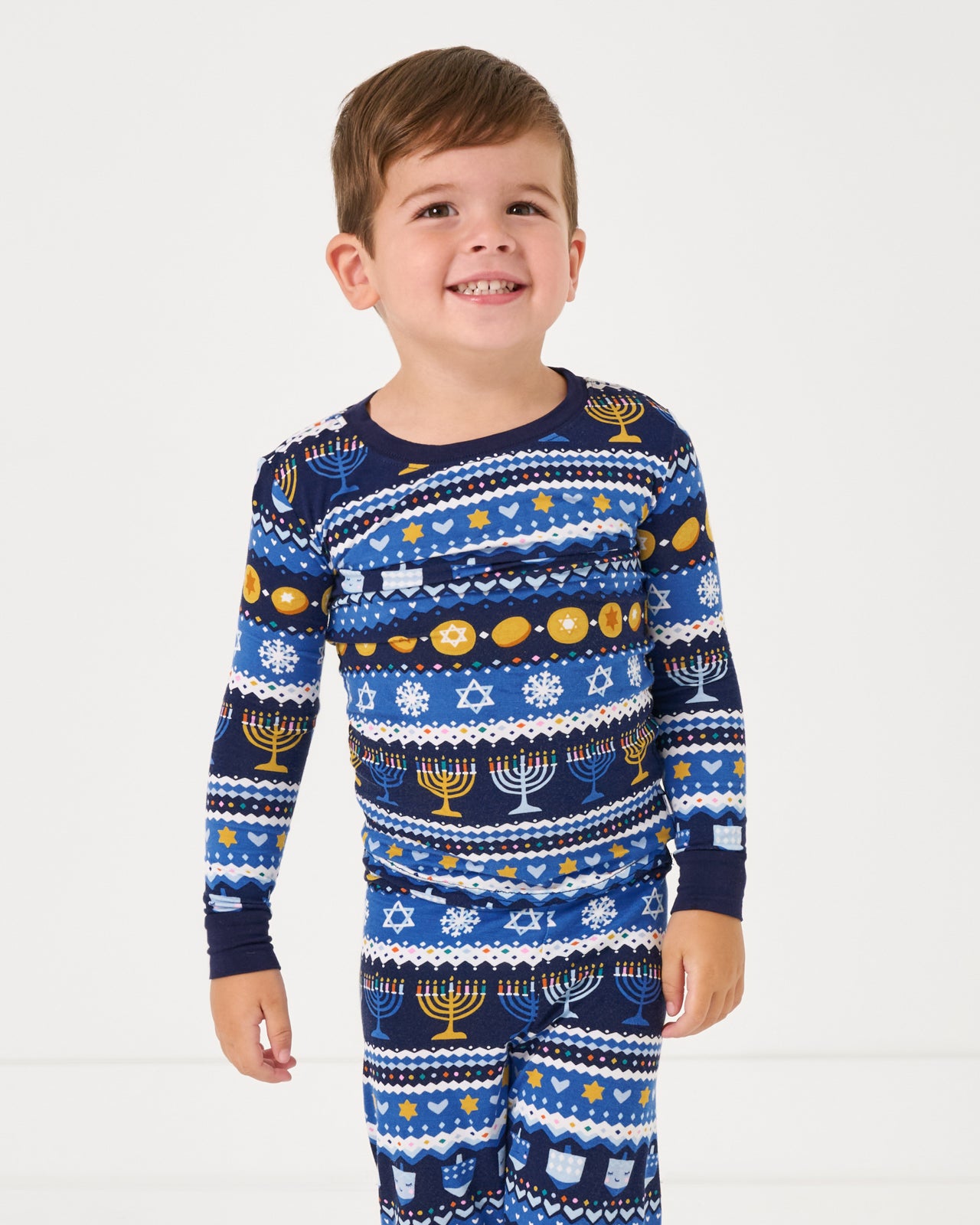 Close up of boy wearing the Hanukkah Fair Isle Two-Piece Pajama Set